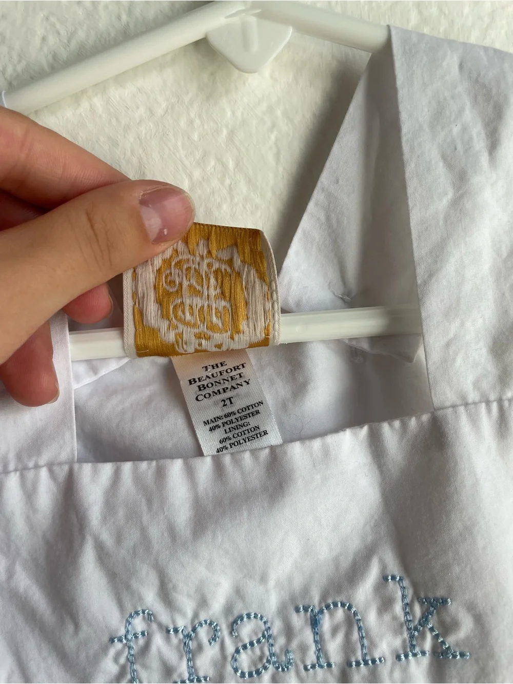 The Beaufort Bonnet Company white bubble outfit embroidered “Frank”